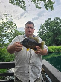 friend David just had to catch a fish out of the pond.