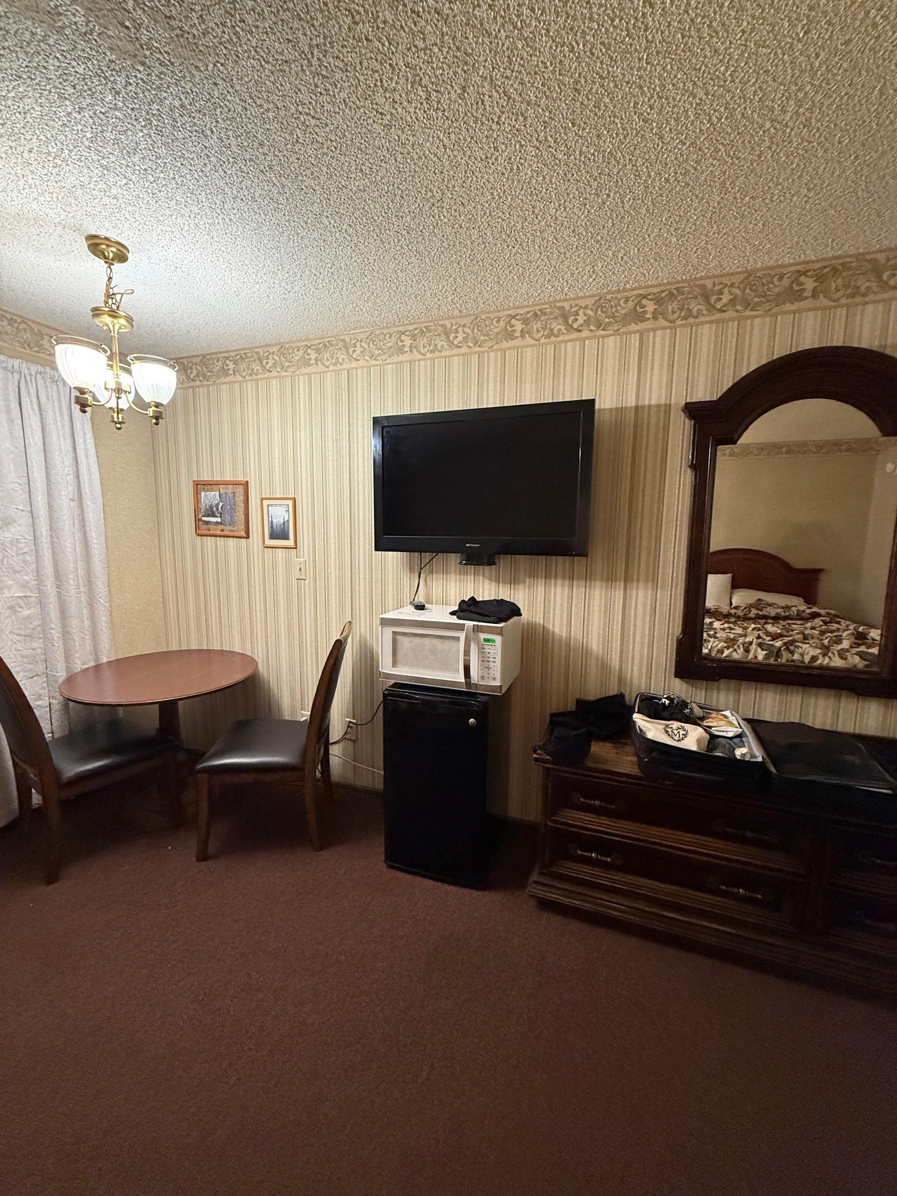 Sitting area, microwave, mini fridge, TV, & dresser