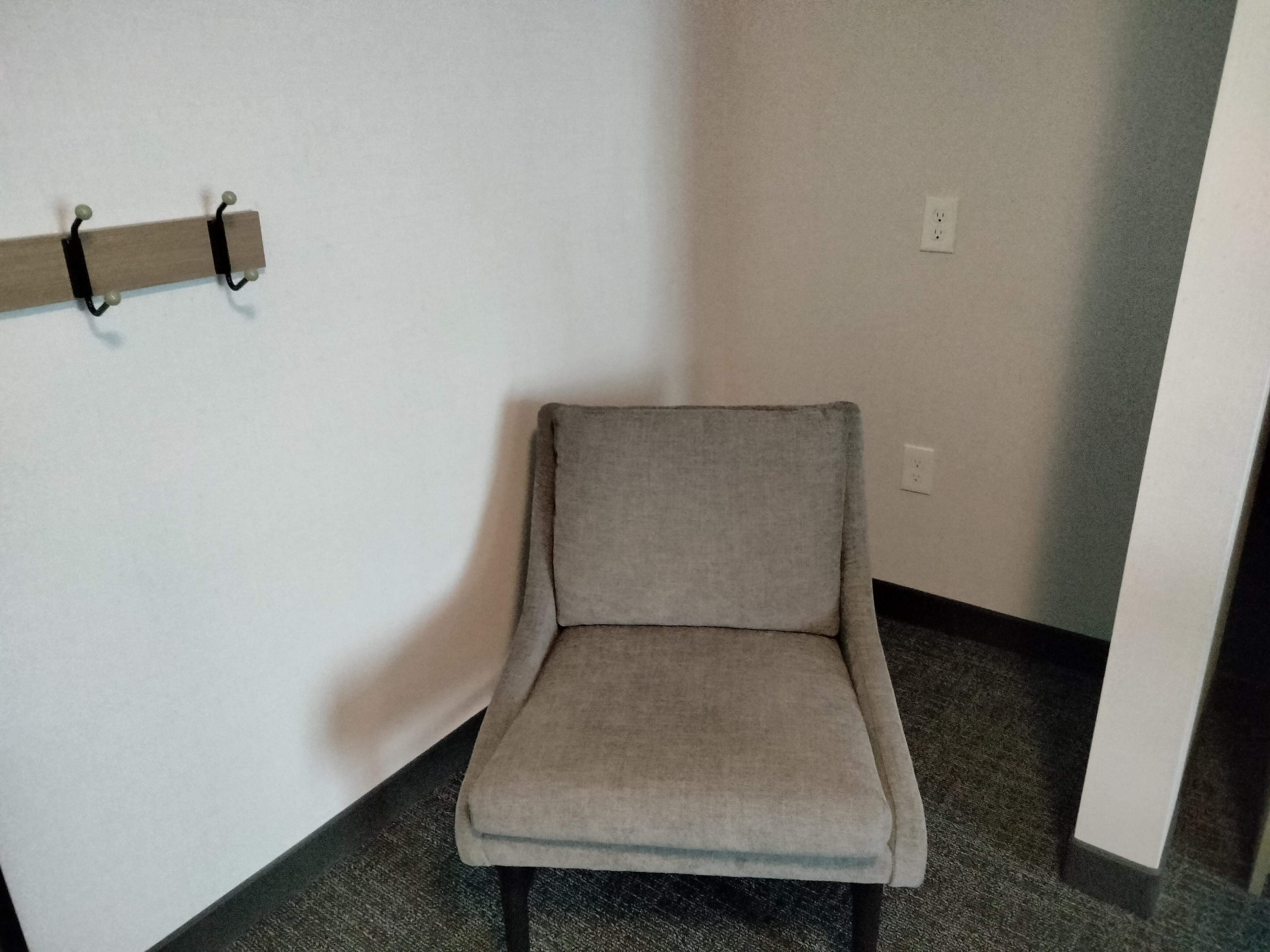 Chair in far corner with FOUR sockets.