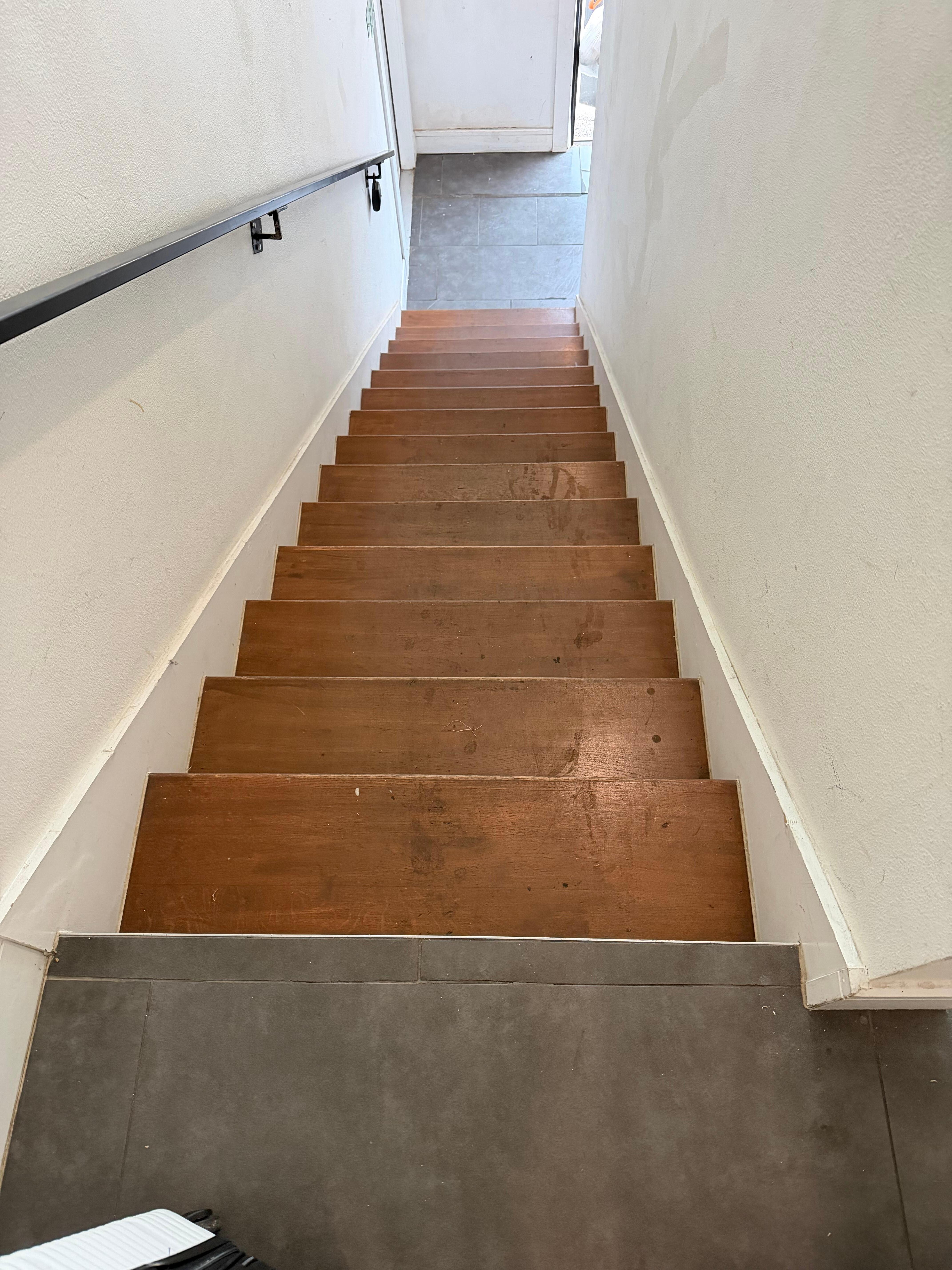 Dirty sticky steps to second floor.