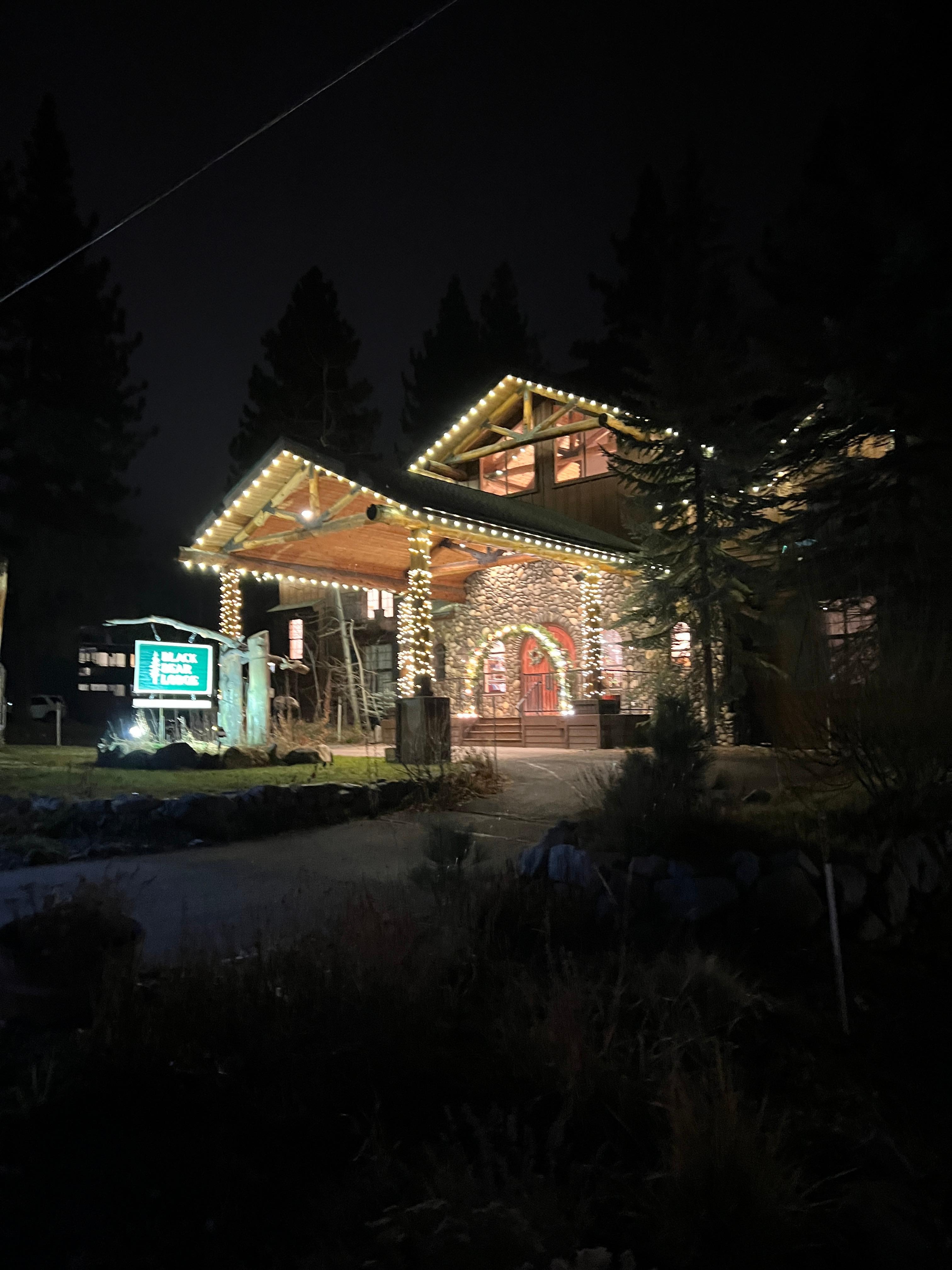 The blackbear Lodge with Christmas lights on at night