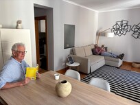 Living room with table for 6, couch & tv