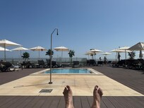 View from a sun lounger by the shallow pool