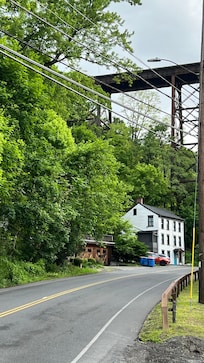 Trains literally overhead and busy street traffic too.