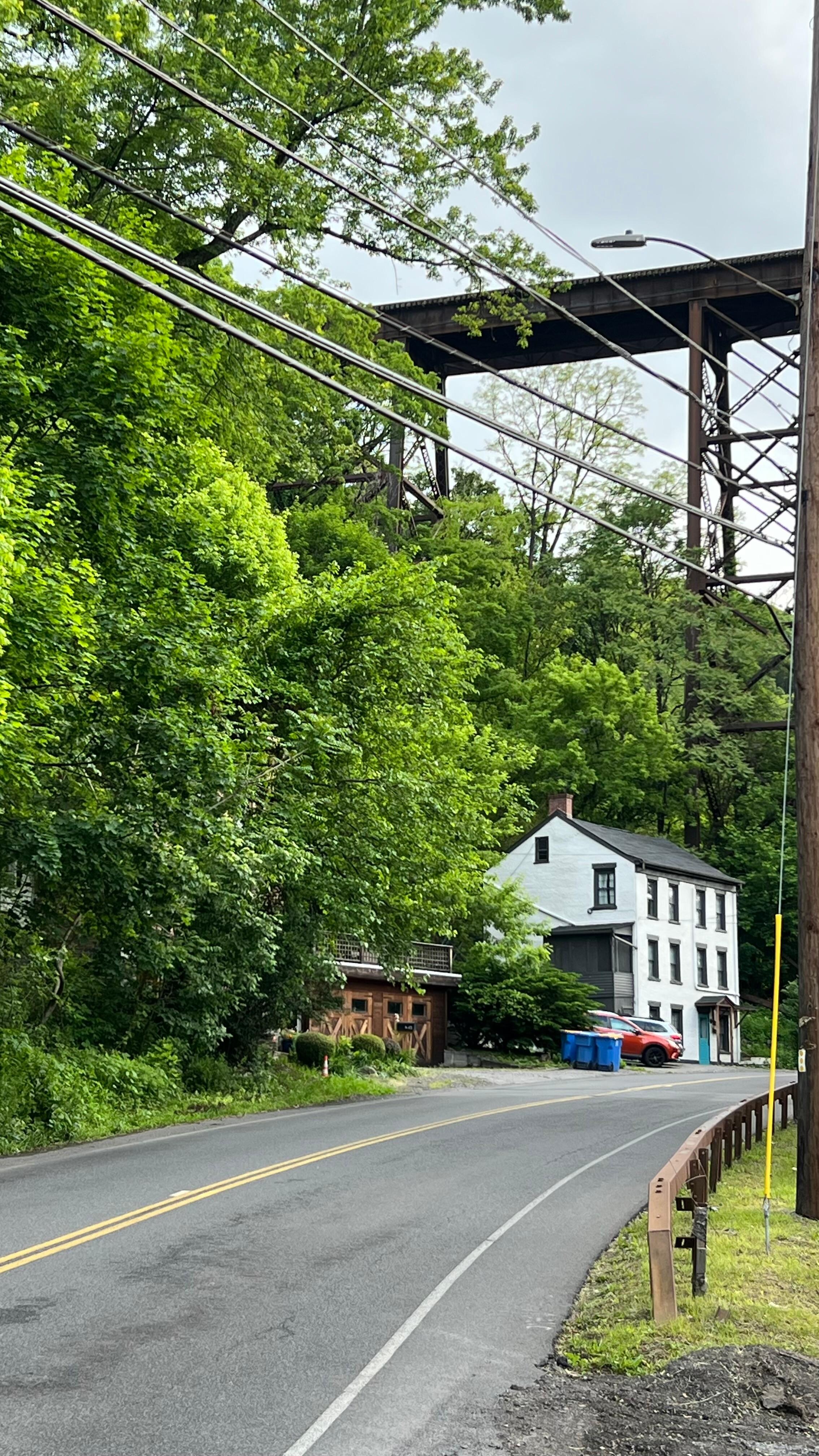 Trains literally overhead and busy street traffic too.