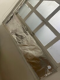 Missing window using foild paper to help gals to stay in place