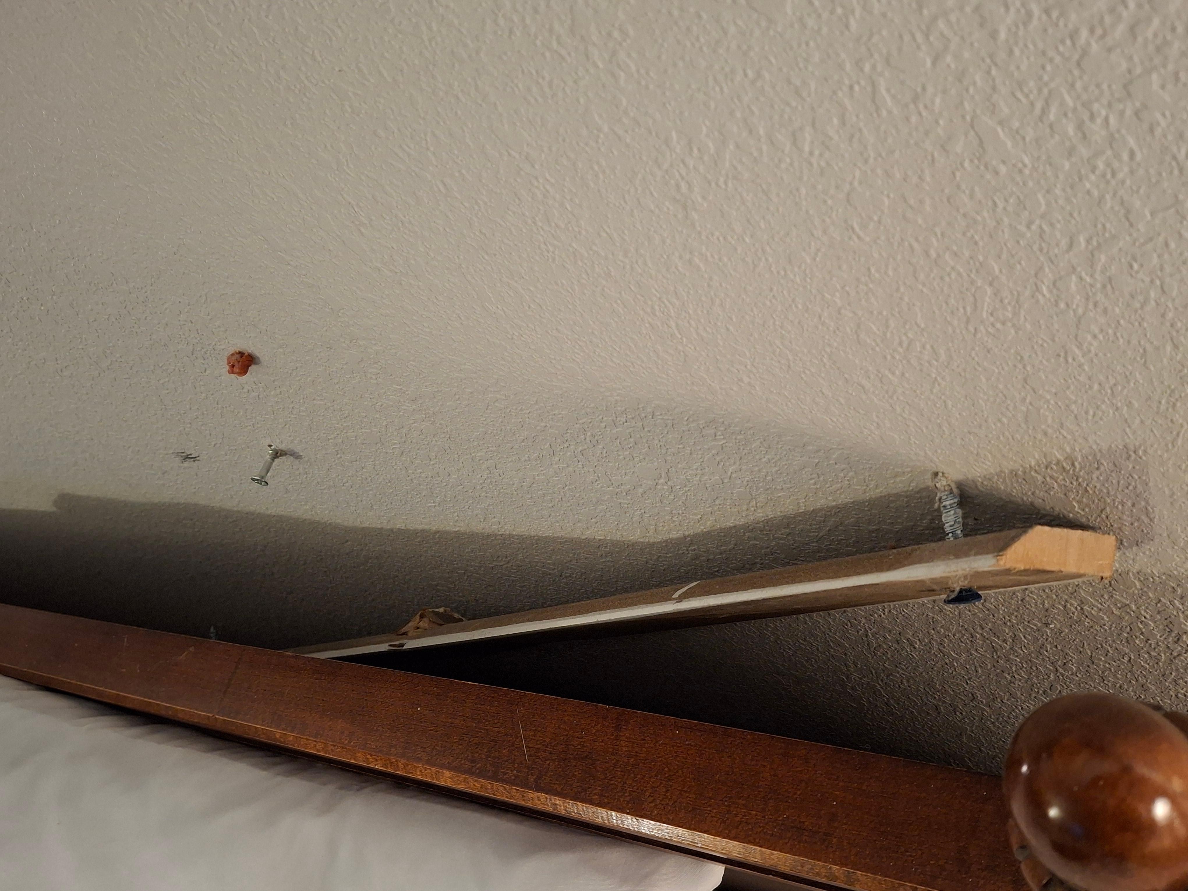 Headboard that fell off the wall while watching tv
