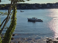 Watching a lobster boat check his traps from our bedroom window.