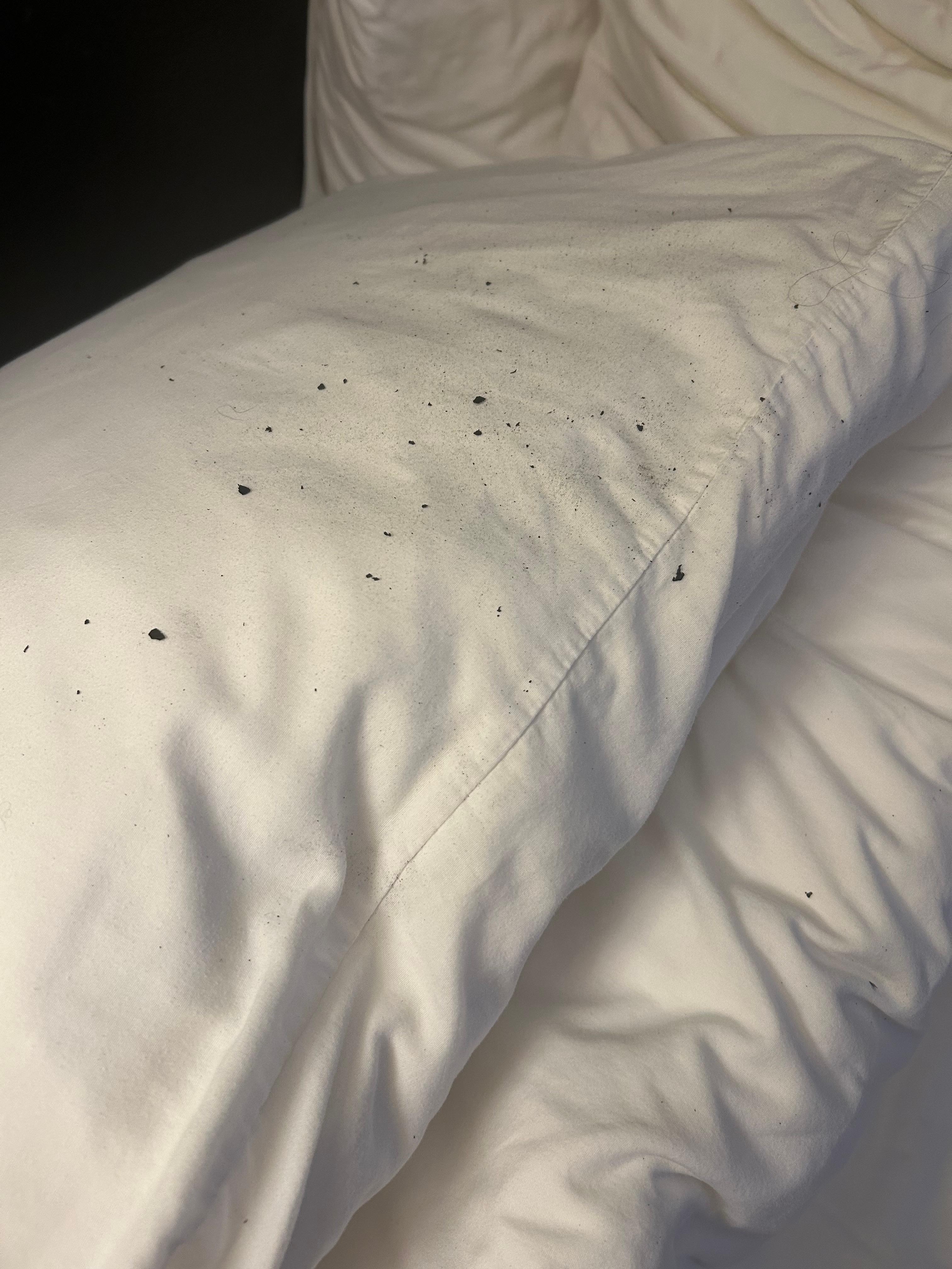 Particles from headboard on the pillows 