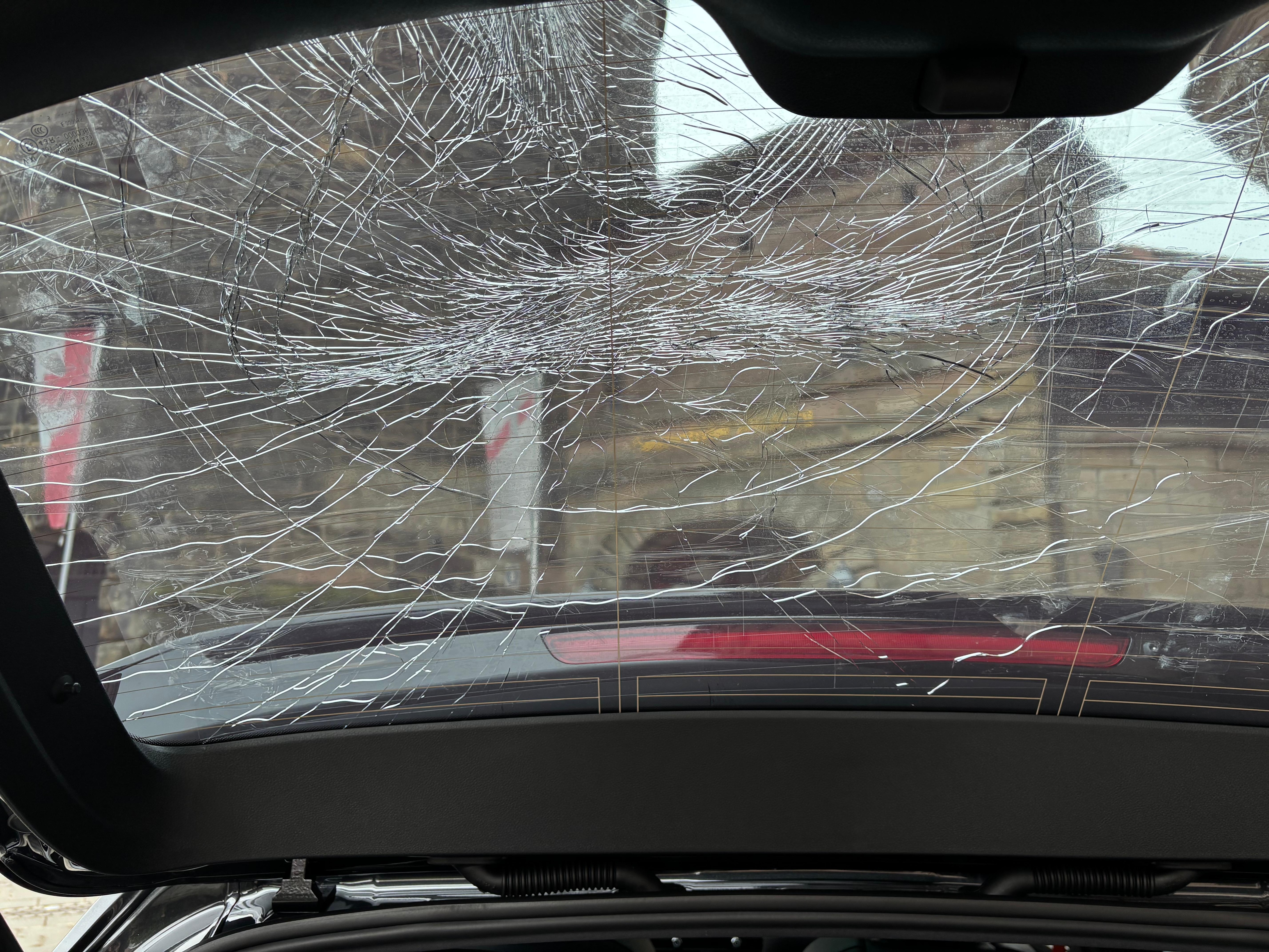 Damage from the poorly lit parking garage and pipe protruding off the wall.  