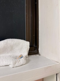 towels sealing from the cold from washroom window