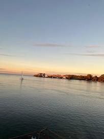Fort Niagara and sailboat at sunset