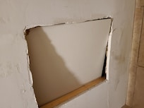 Right over the shower. You can be viewed anywhere in the bathroom!
