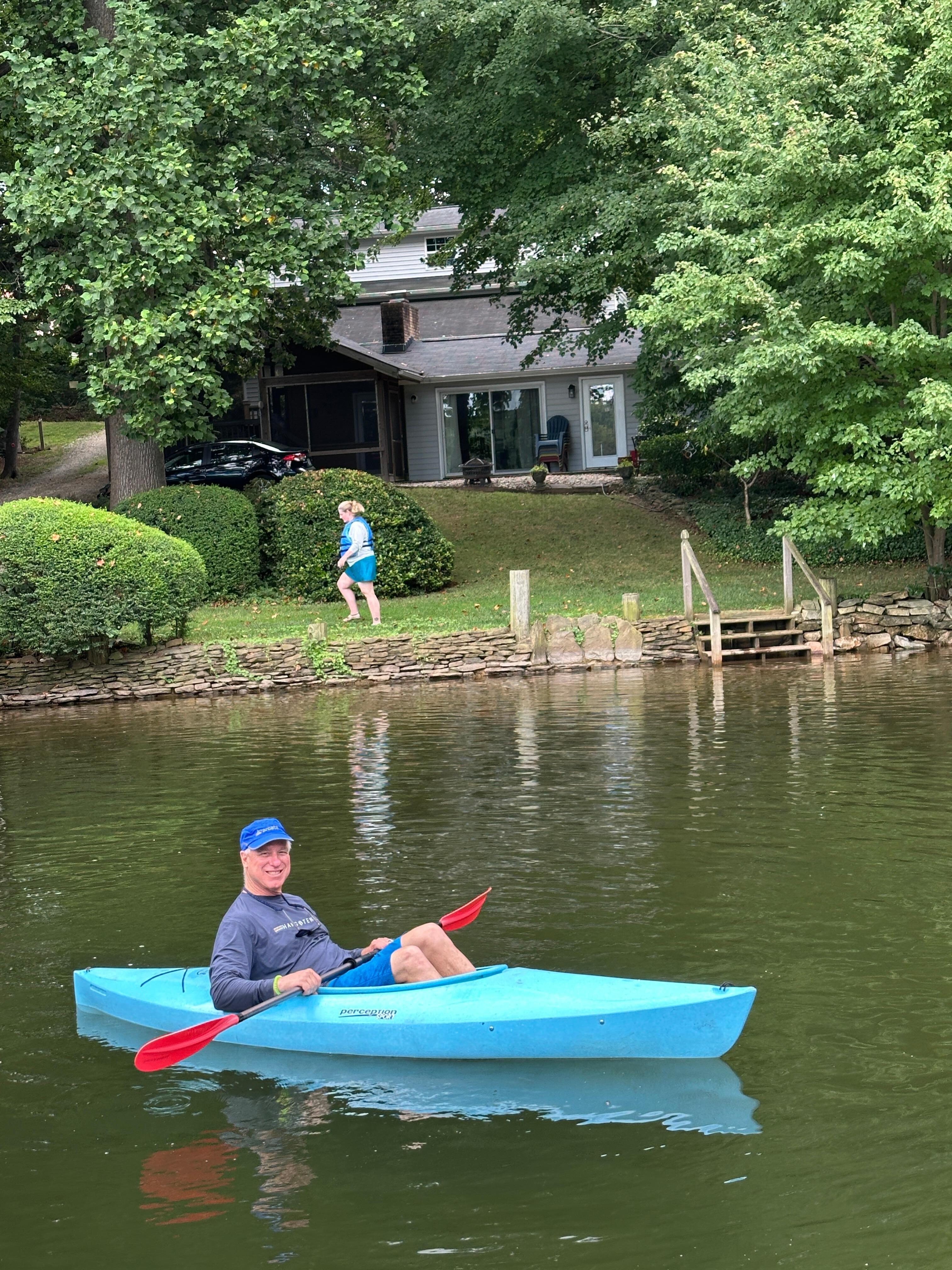 Kayaking with house in background
