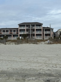 The unit is top floor, taken from the beach.