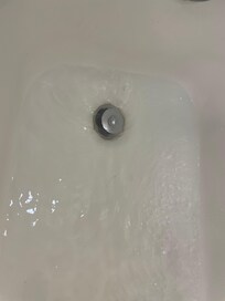 Shower wouldn’t drain, standing water - room shouldn’t have been rented