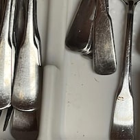 dirt in the utensil drawer, zoom in there might be a small hair