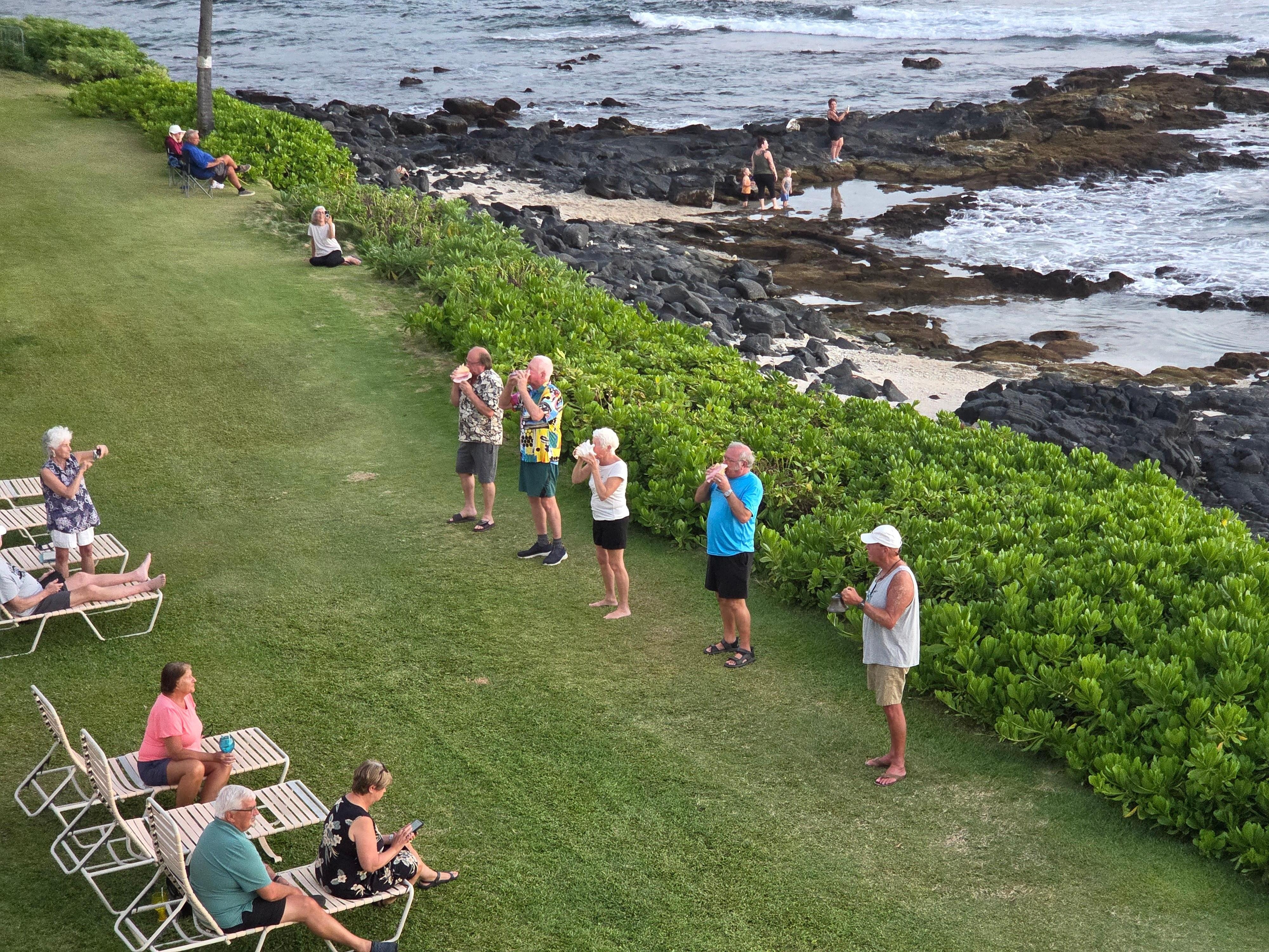 Kona Reef residents blow conch shells (Pu) each day at sunset as seen from the Lanai.