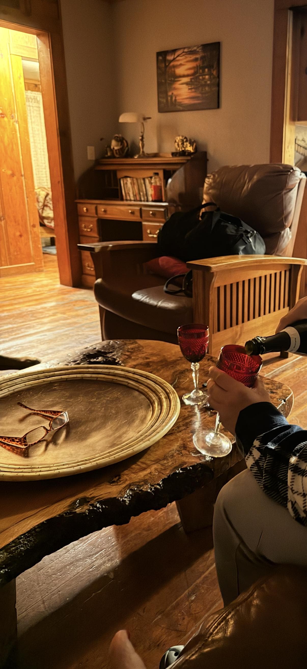 Cozy living room with beautiful burl table. 