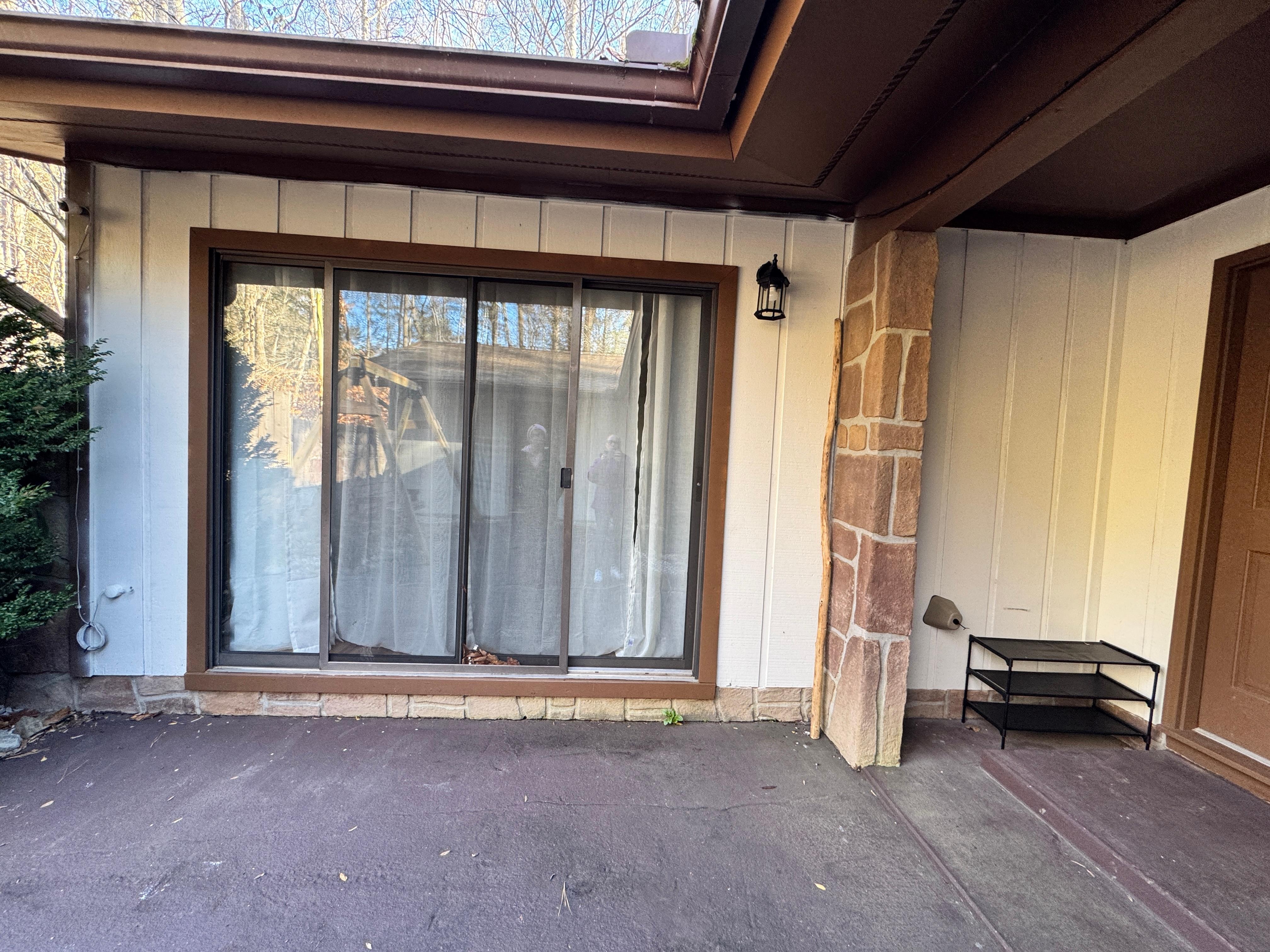 Door that is unsafe and allowed freezing coming into the room. 