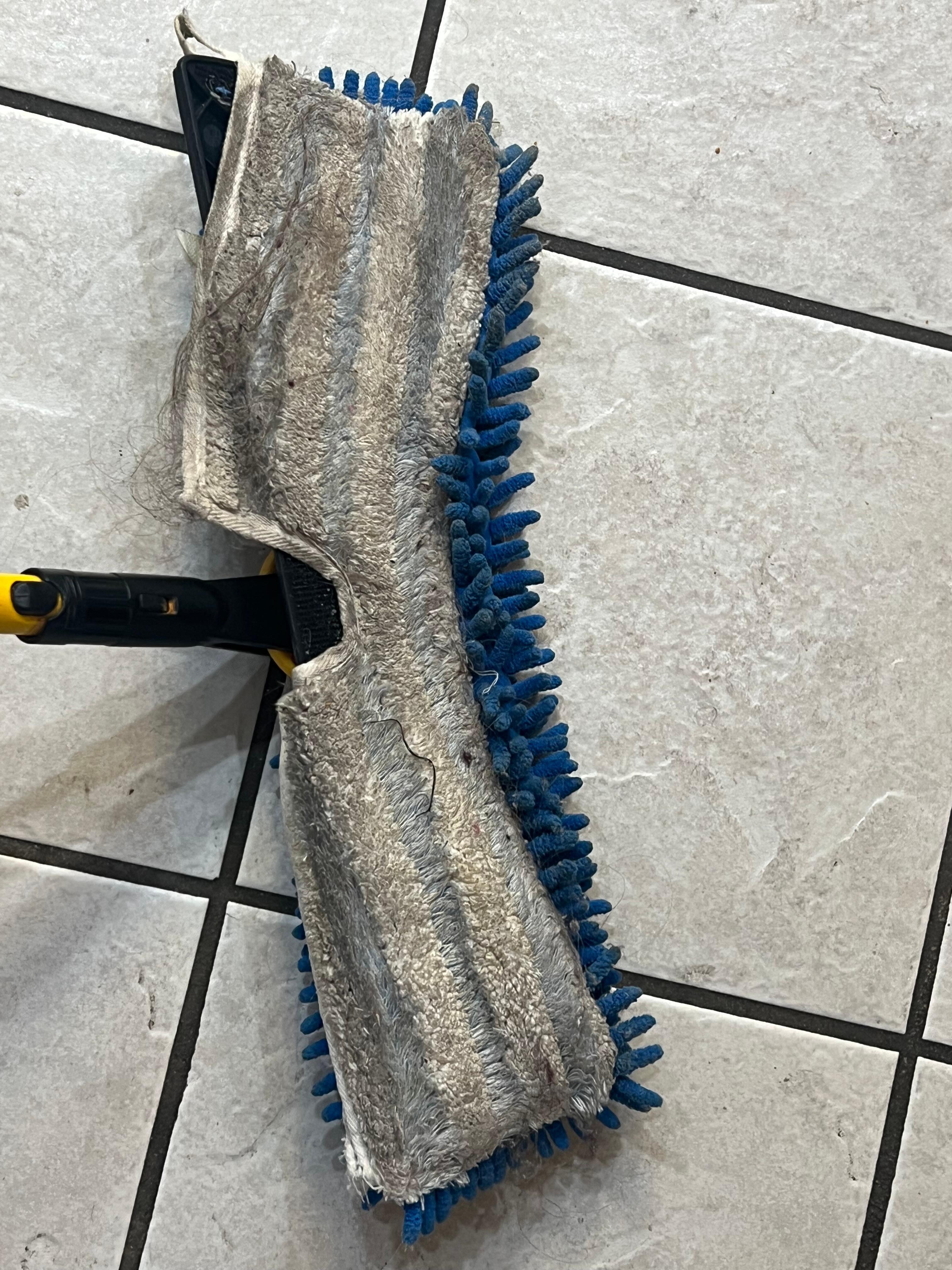 The nasty dust mop that was used to clean the unit. This was like this when we entered the unit. We had to buy our own mop & bucket.