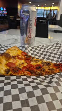 Pepperoni and Sausage slice if pizza at Pop Up Pizza inside the Plaza Hotel and Casino. One of the best pizzas I've had in a very long time. So good I even bought some for my group of friends I was there with. All of us enjoyed it.