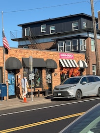 Great coffee shop (plus pastries) right next door. Our condo had 2 porch/balcony/stoop areas (one visible here) to sit out in and get a look toward the lake.