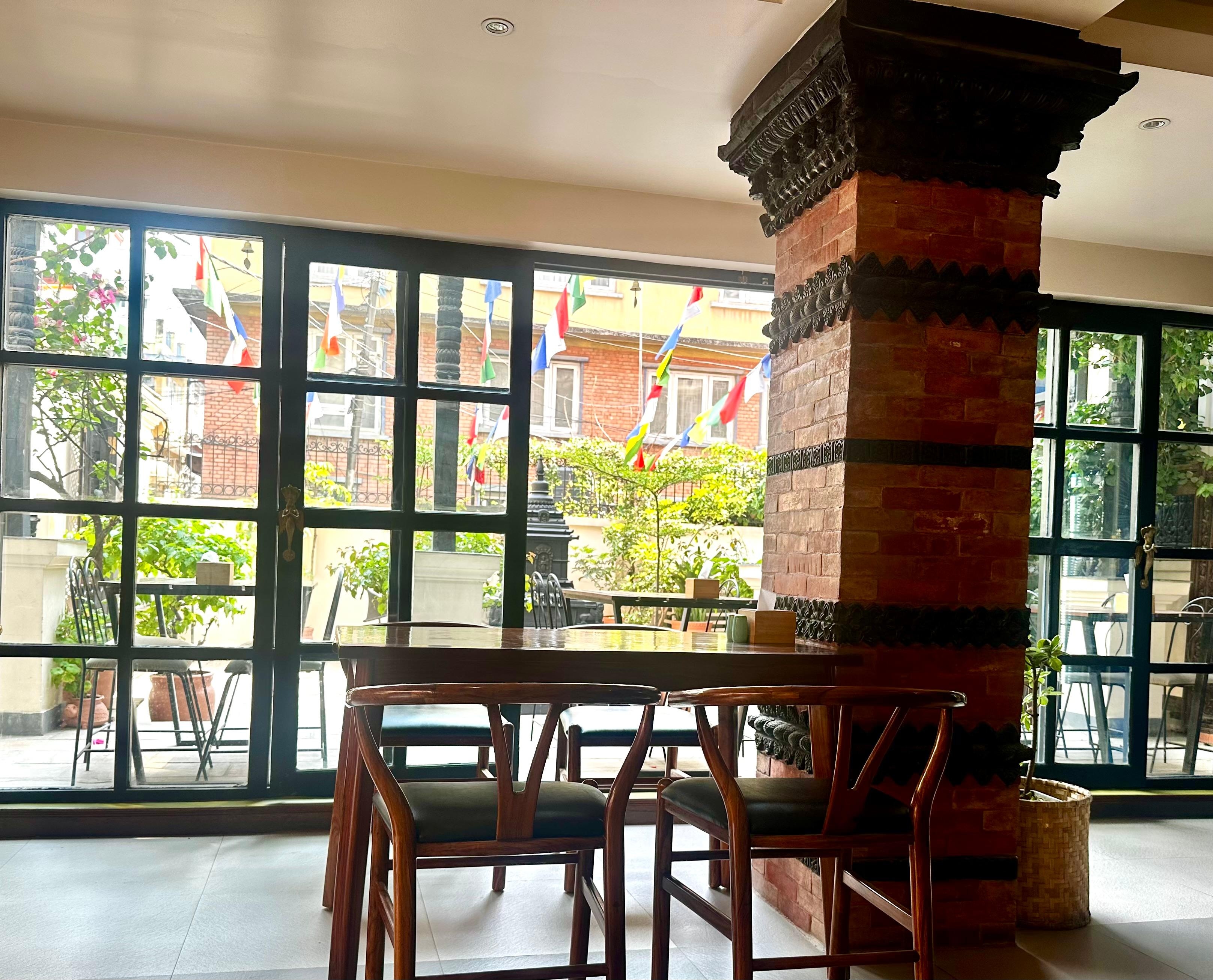 Interior room where breakfast is served, looking out into the courtyard.