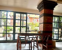 Interior room where breakfast is served, looking out into the courtyard.