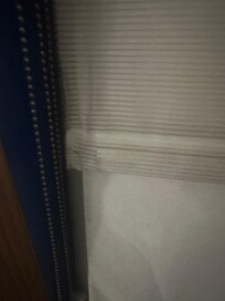 Dirt in the corners of bathroom floors.