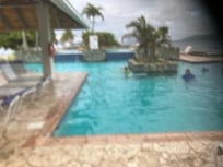 one side of the outdoor pool