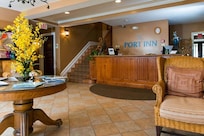 Quaint Inn with lobby and guest services on 1st floor.