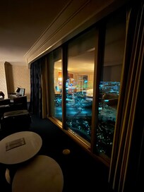 View from a comfortable sofa and chairs, overlooking the strip and airport.