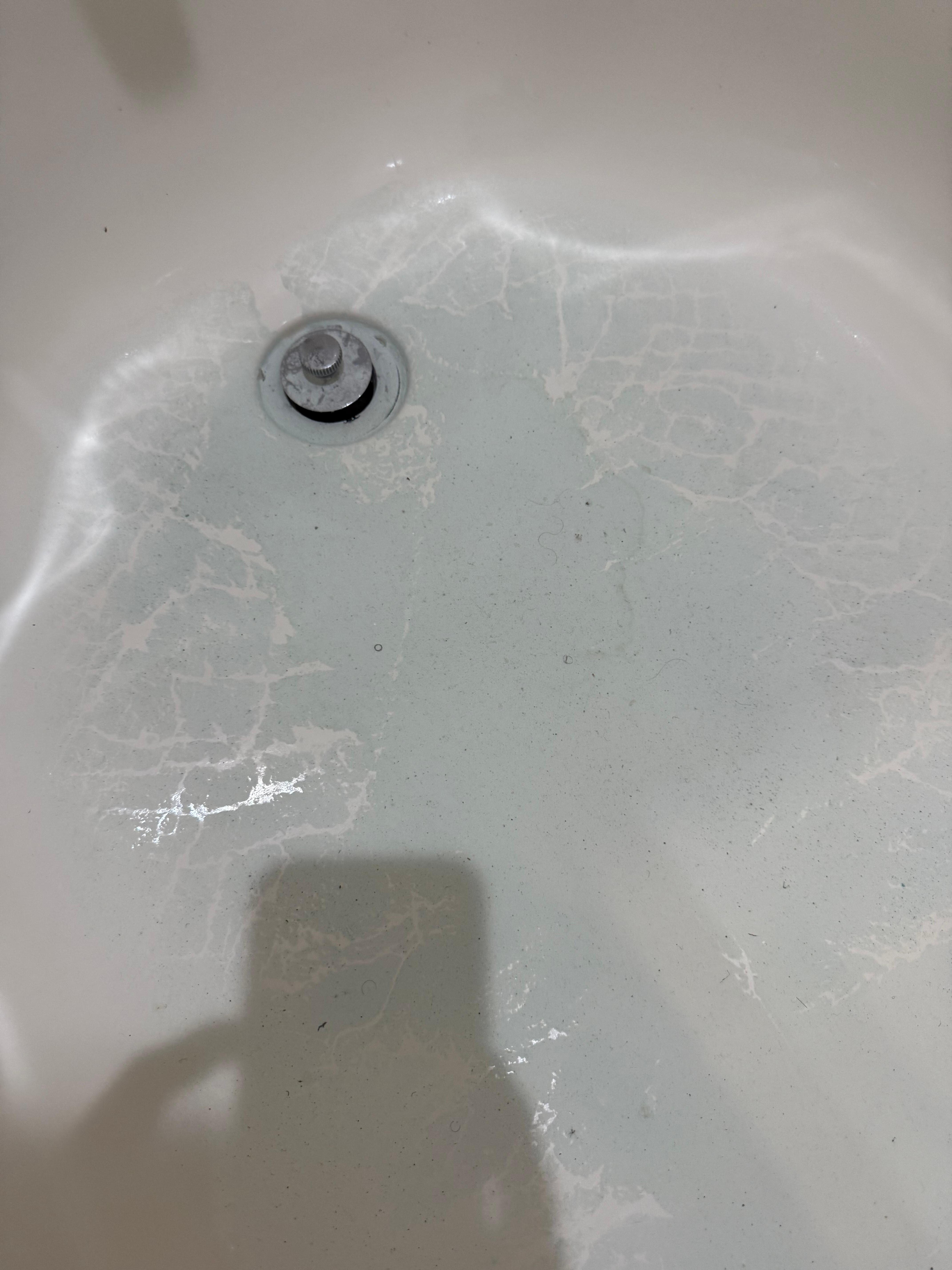 Tub had cleaner in it that had dried.