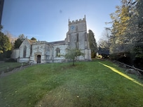 The church immediately behind the cottage