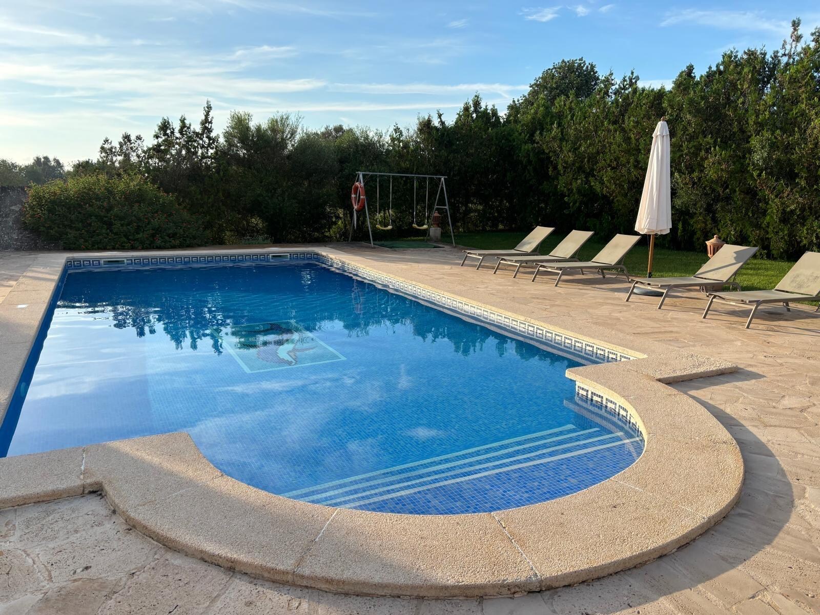 Outdoor pool is pristine.
