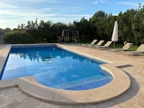 Outdoor pool is pristine.