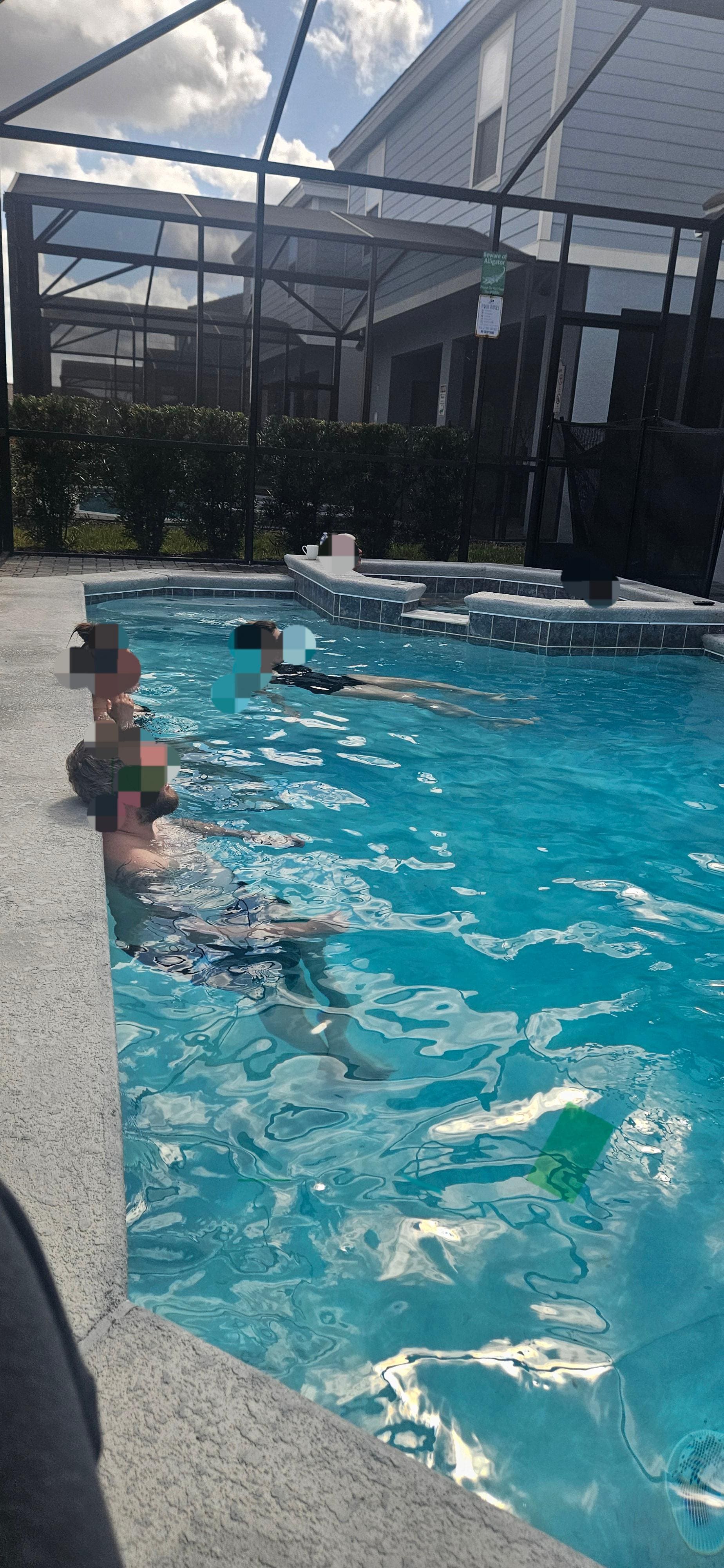 Relaxing in the pool watching a movie on the patio TV