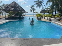 Nice pool with sunbeds, shade and even electricity for charging phones!