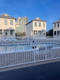 Front of house with pool right outside the front door