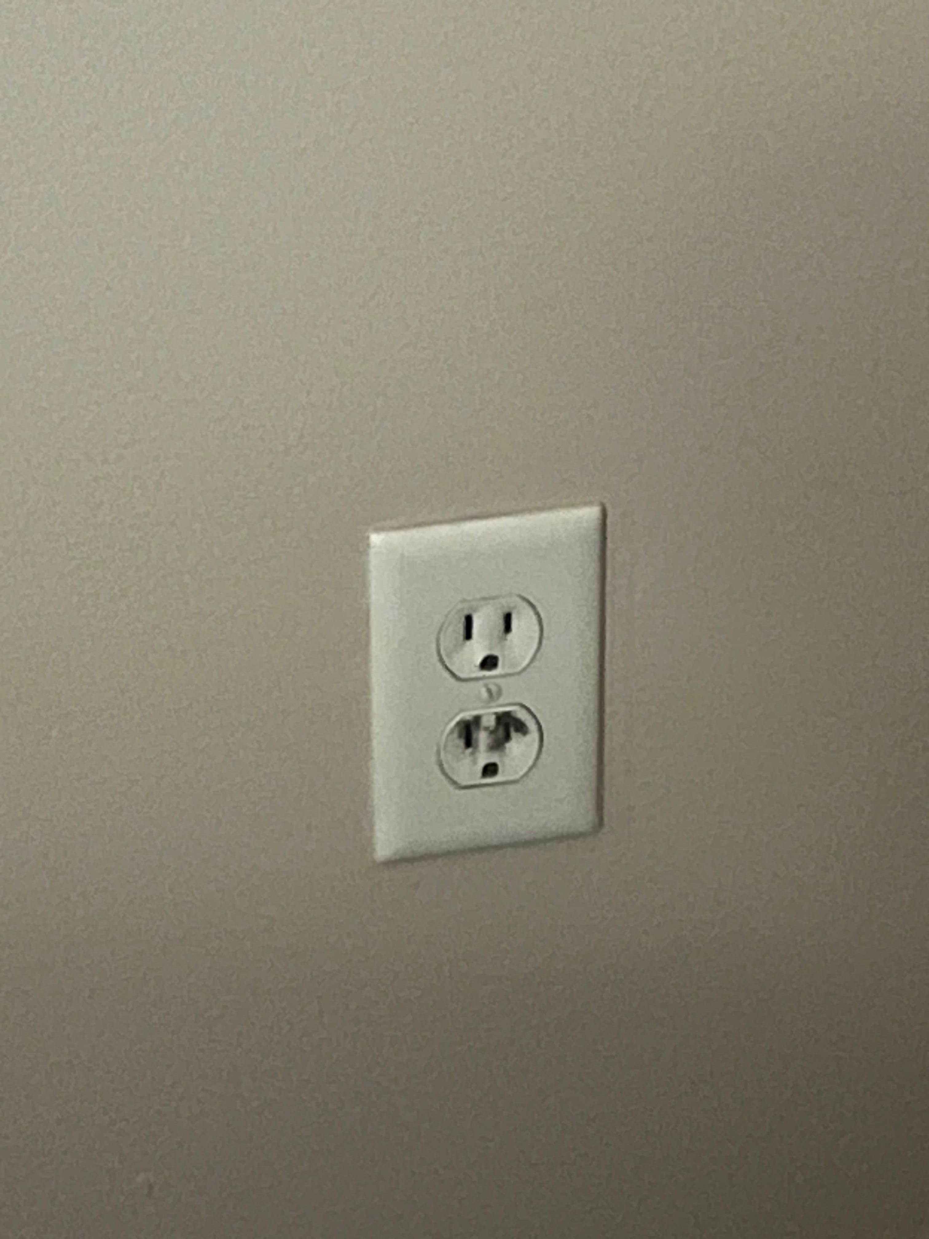 Burn marks adorning the electrical socket. 