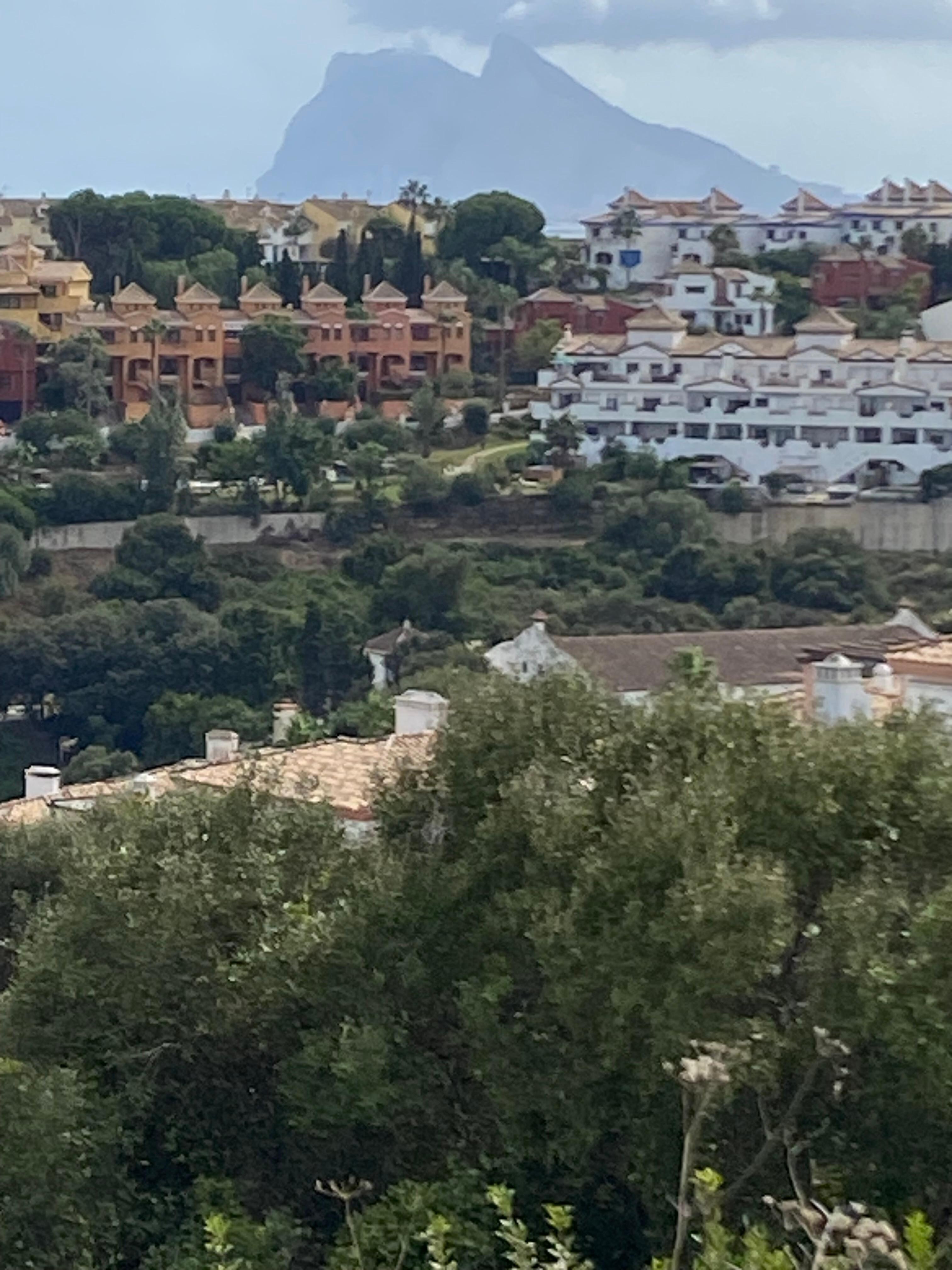 Walk to the beach with “that rock” in the background 