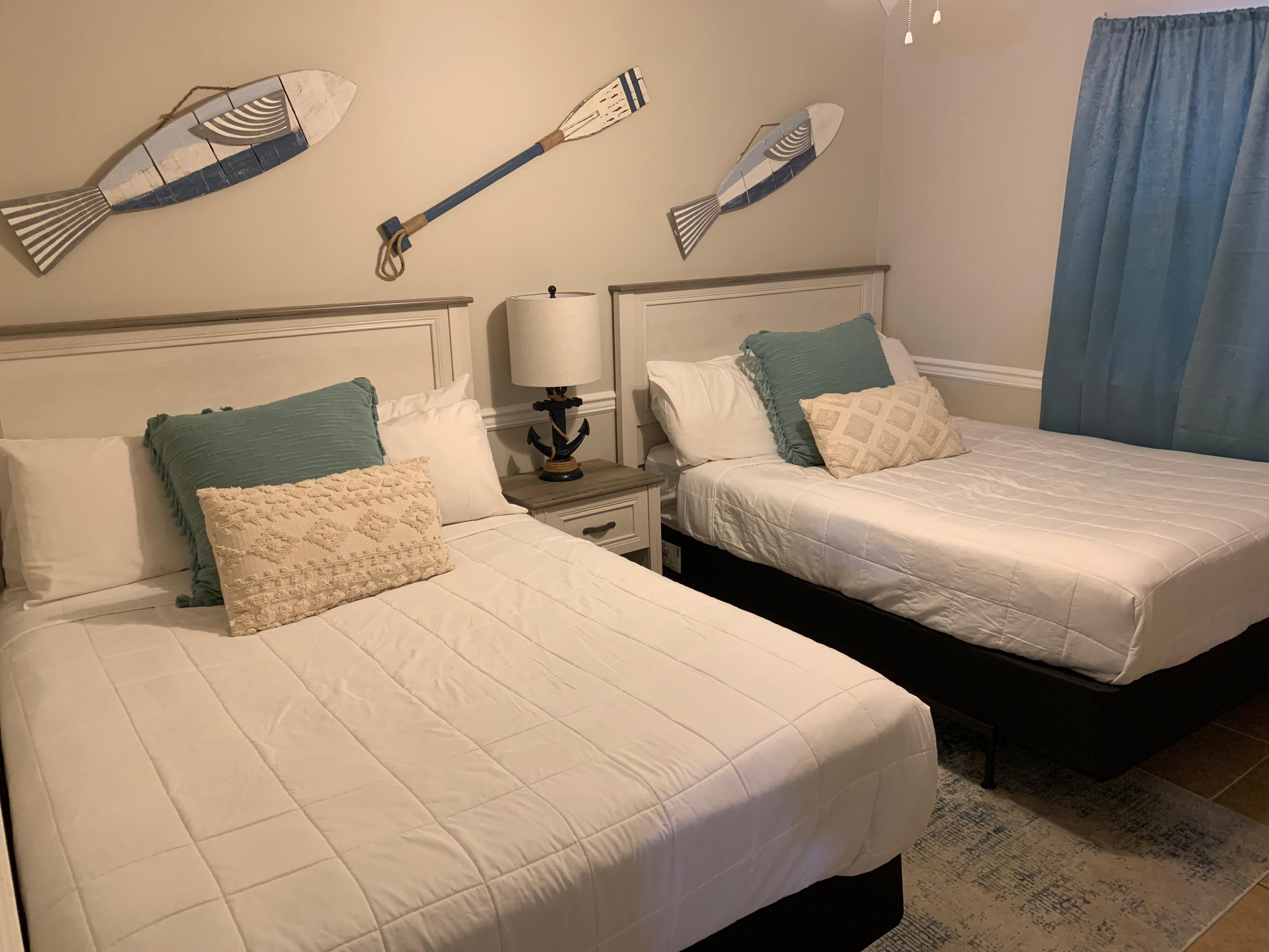 Second bedroom with two full beds