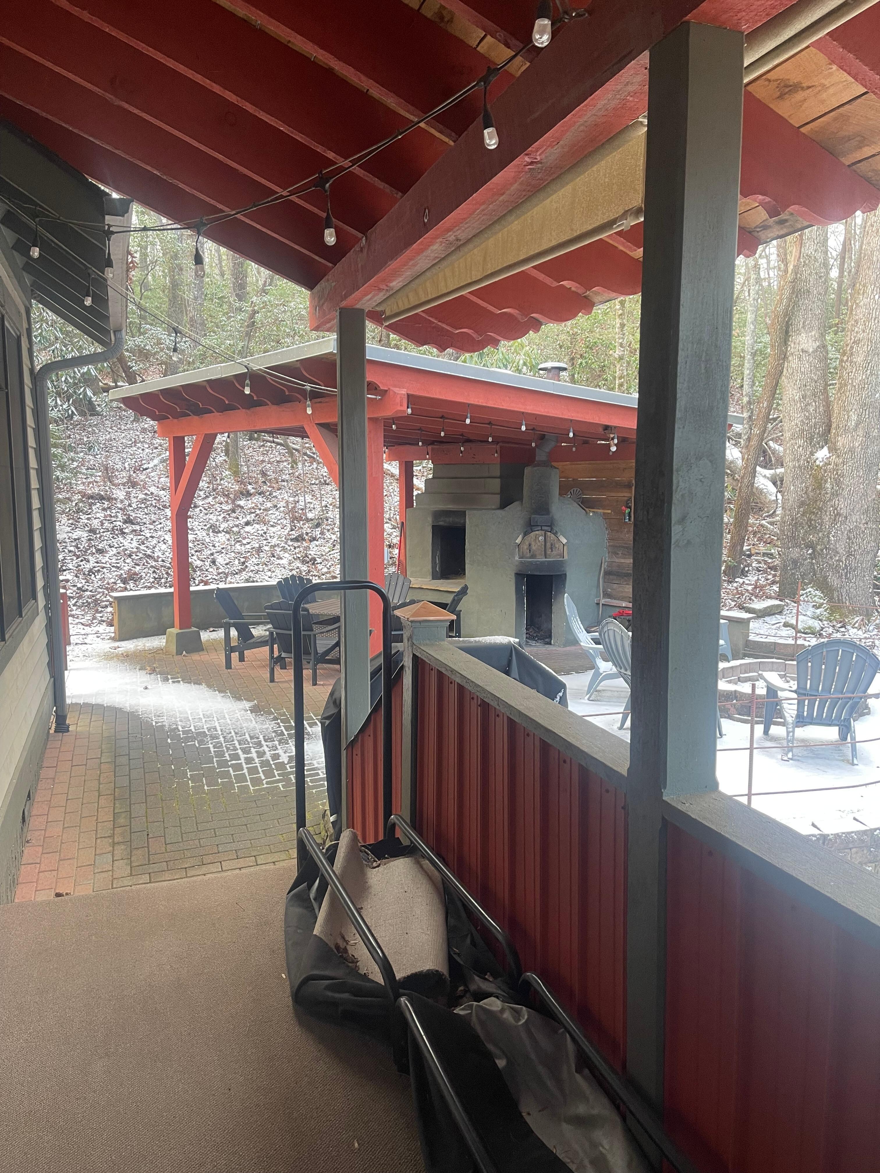 The back of the property with view of fire pit