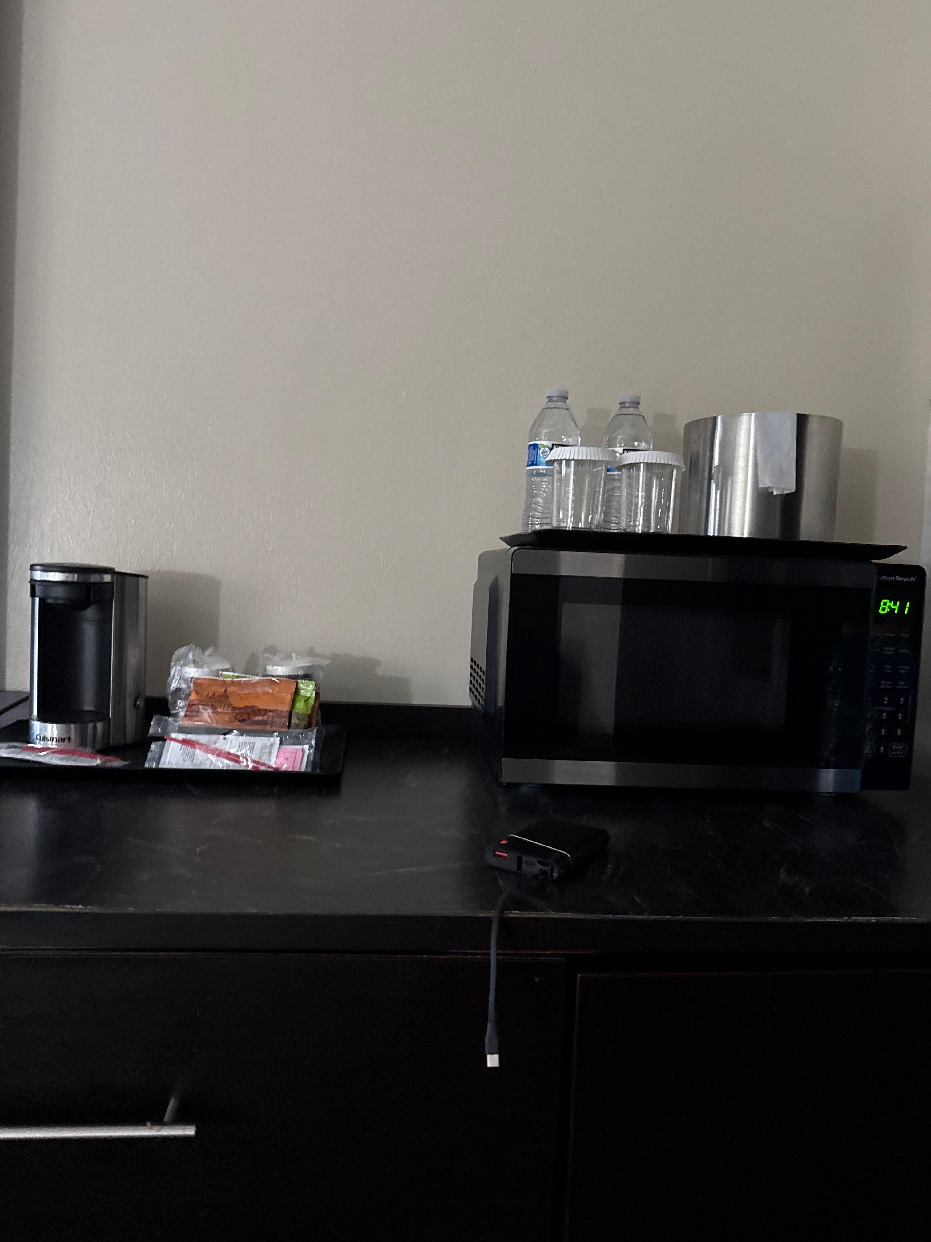 Has a coffee maker, microwave and refrigerator 