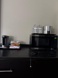 Has a coffee maker, microwave and refrigerator