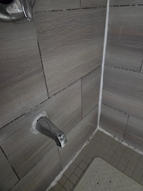 Sealant peeling and moldy indicating the shower has not been maintained nor cleaned to hygenic standards