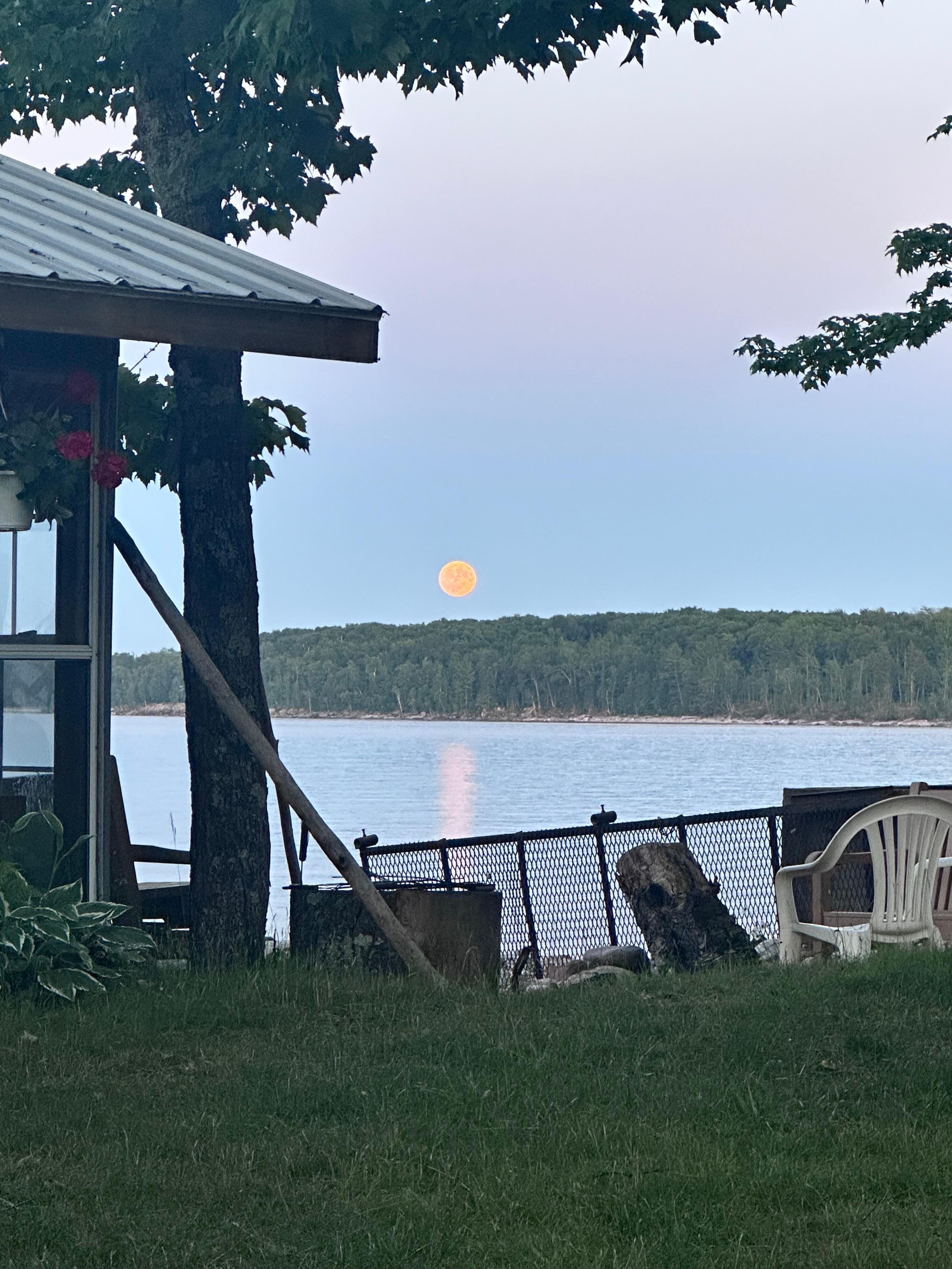 Moon rising over Lake Superior from docks at Kimar resort. 