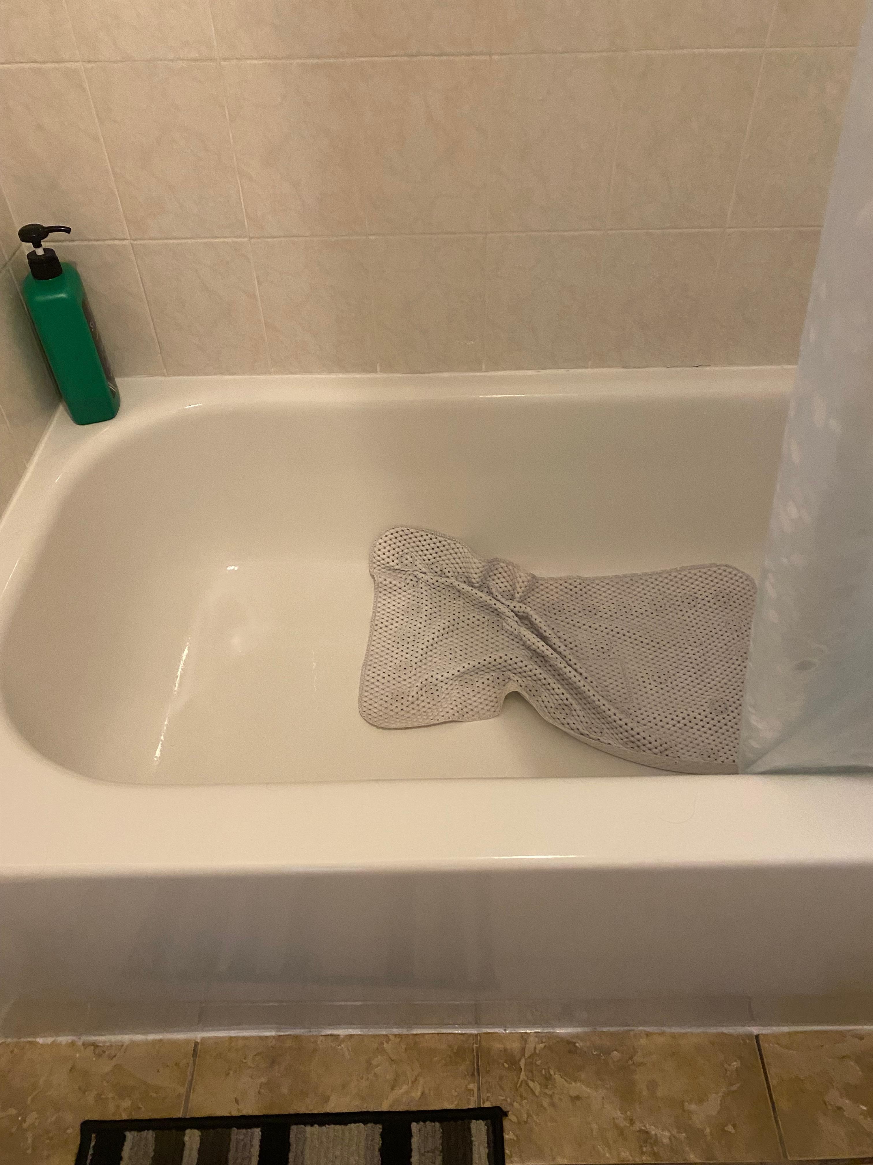 Tub with mat that nearly took me down more than a couple times. 