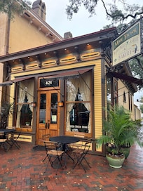 Just at the corner, aprox two houses down